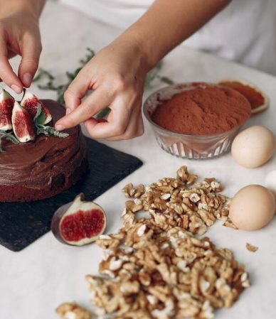 chef-white-clothes-prepares-chocolate-cake-lady-is-preparing-dessert-woman-bakes-cake_1157-42202